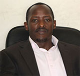 Dr Christopher Kayumba