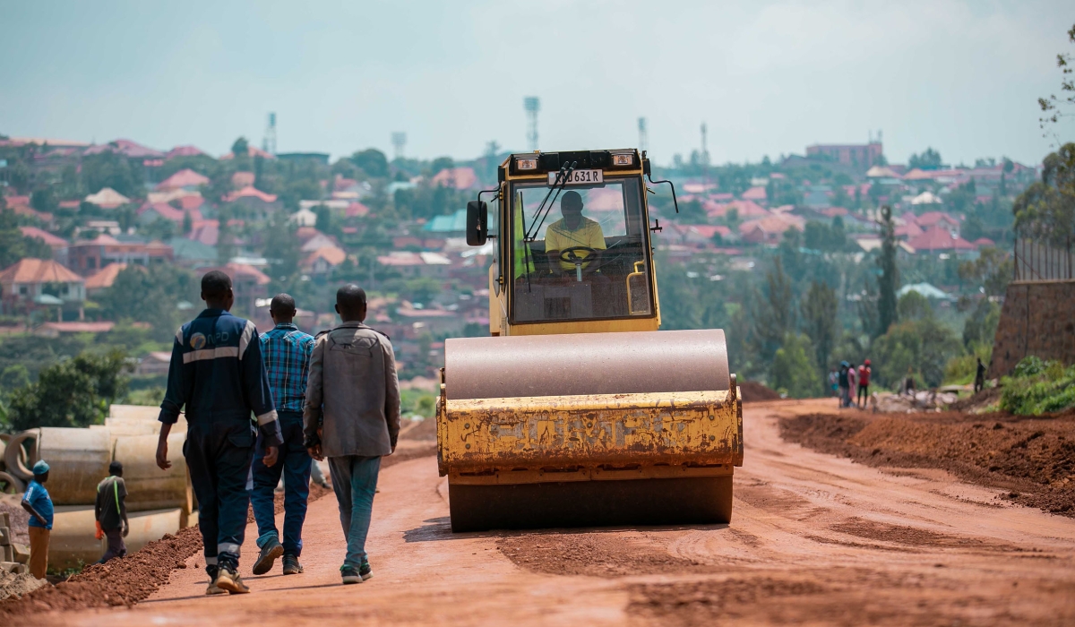Workers during road construction activities in Remera, Gasabo District. Government has urged the general public to pick interest in the way the national budget is used. / Photo: Craish Bahizi