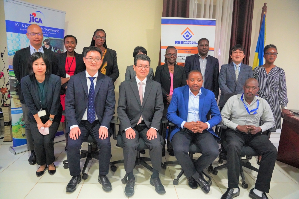 Officials pose for a group photo during a joint seminar. / Craish Bahizi