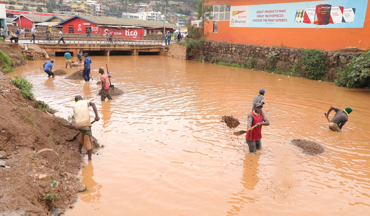 Workers removing sands in Mpazi drainage at Nyabugogo before upgrading the channel to avoid floods and water pollution in Nyabugogo river in Kigali. / Photo by Craish Bahizi