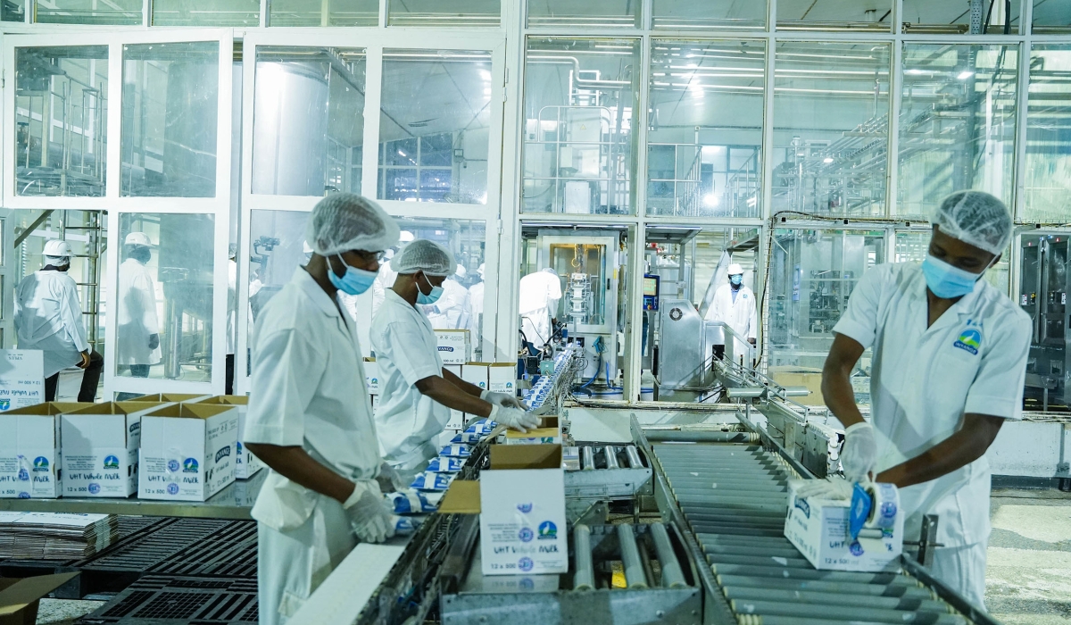 Workers package milk at Inyange Industries in Kigali on December 16, 2021. / Courtesy