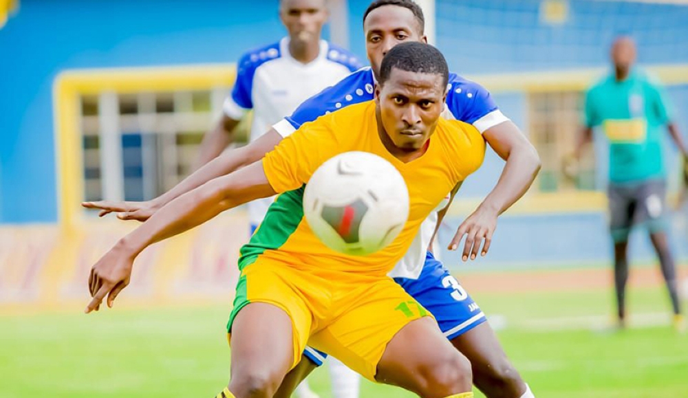 Etoile striker Samuel Nwosu protects the ball during a past match against Gorilla FC. He is among three elite strikers without clubs  as the new football season kicks off on Friday. Photo: Courtesy.