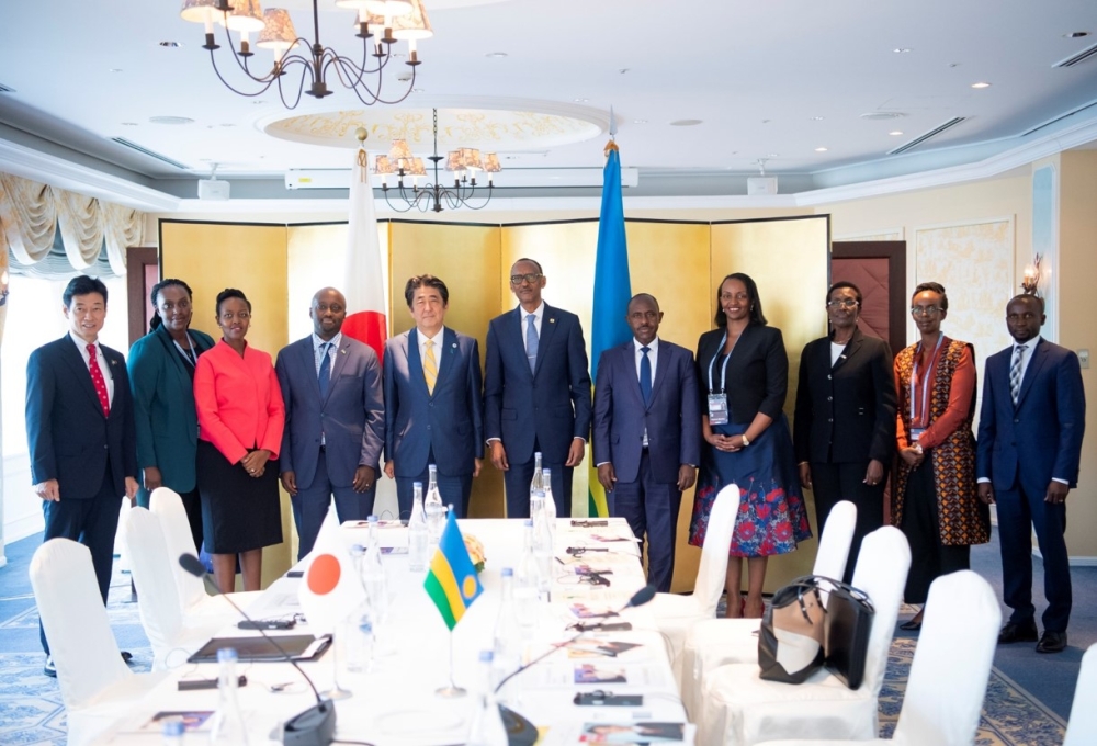 Paul Kagame, the President of the Republic of Rwanda  with Shinzo ABE, the Former Prime Minister in a group photo with the Rwandan delegation at The 7th Tokyo International Conference on African Development (TICAD7). Photo by the Ministry of Foreign Affair of Japan.