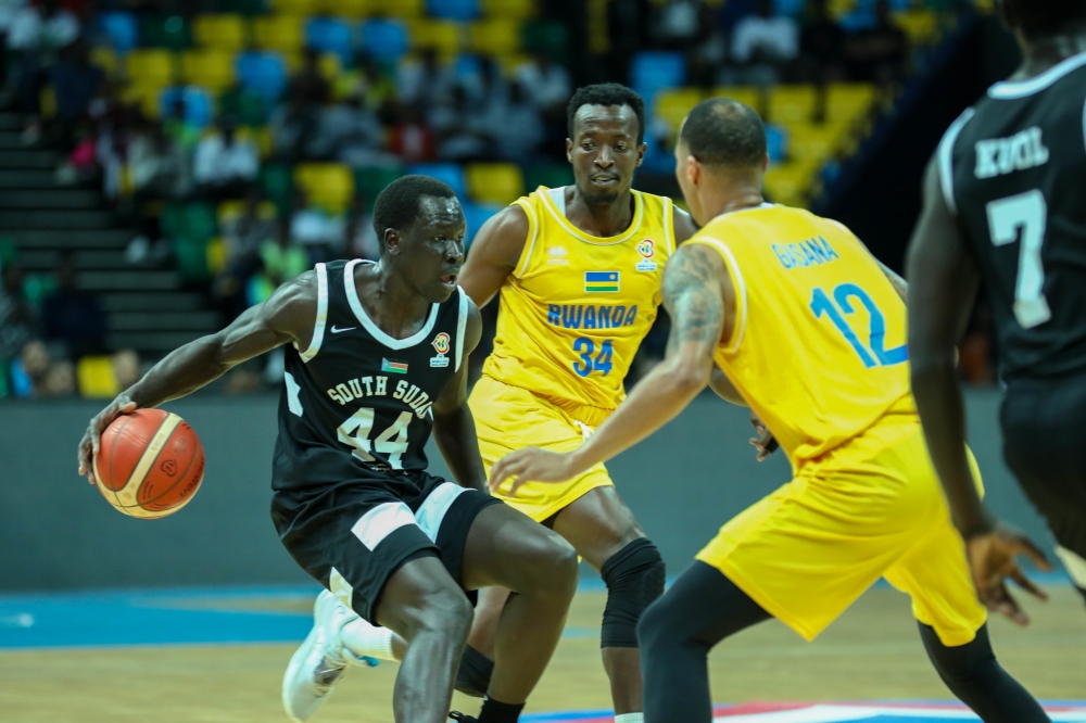 A South Sudan player tries to go past Rwandan players in a past game at the BK Arena. / Photo: Dan Nsengiyumva