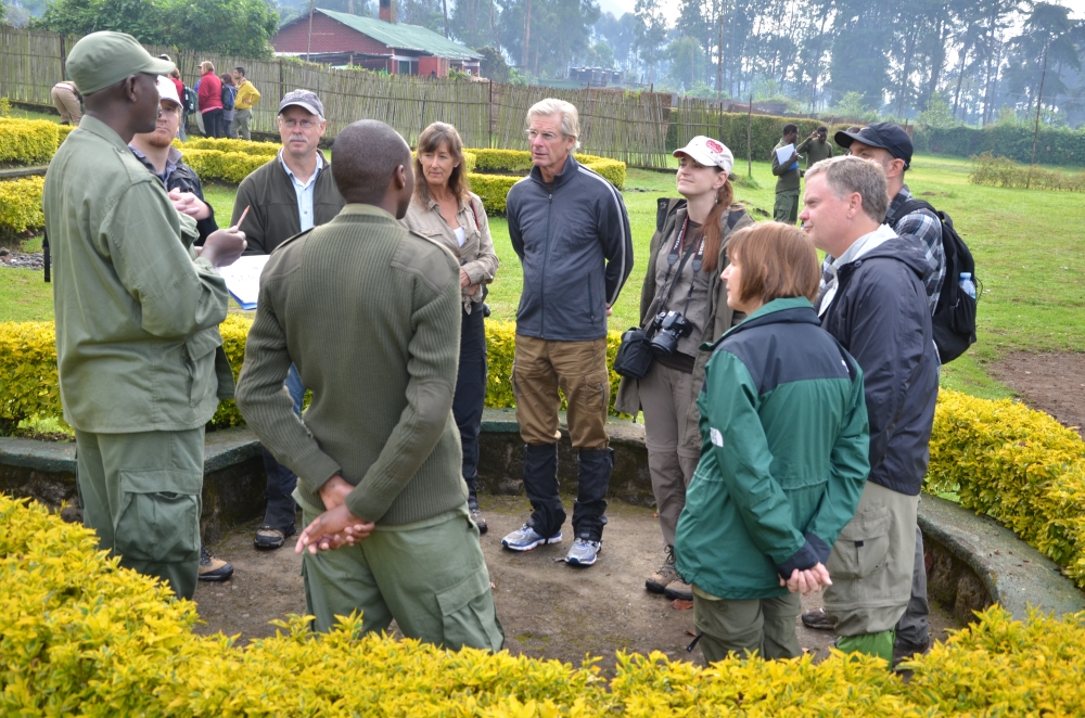 Tourists listen to a tour guide before trekking to see mountain gorillas at the Volcanoes National Park. Rwanda is set to generate up to $360 million revenue from the tourism industry in 2022. Photo:Sam Ngendahimana.