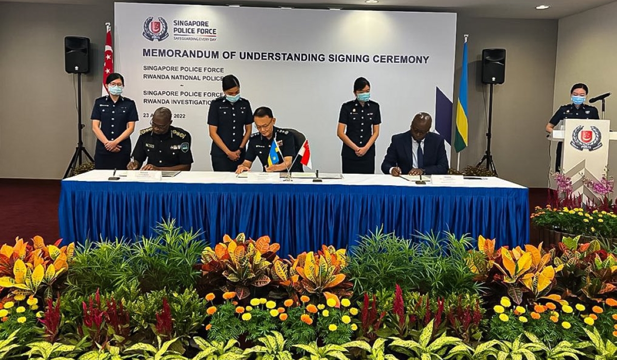 IGP Dan Munyuza and his counterpart CG Hoong Wee Teck during the  signing ceremony of the agreement in Singapore Tuesday, August 23.