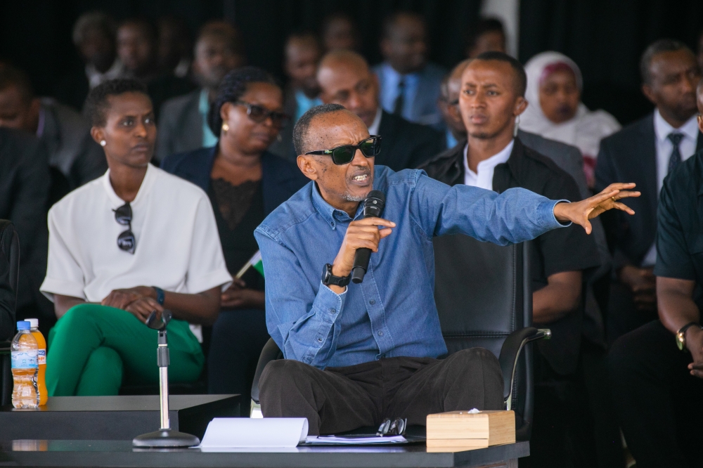 President Paul Kagame reacts to a question raised by one Pierre Bizimana, a taxi-moto operator based in Ruhango District. Kagame has promised taxi-moto operators a quick and permanent solution to their hefty insurance bills. / Photo by Olivier Mugwiza