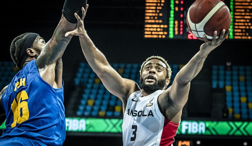 Angola’s Gerson Goncalves, with the ball, against Prince Ibeh of Rwanda, during a past game in Kigali. Photo: Courtesy.