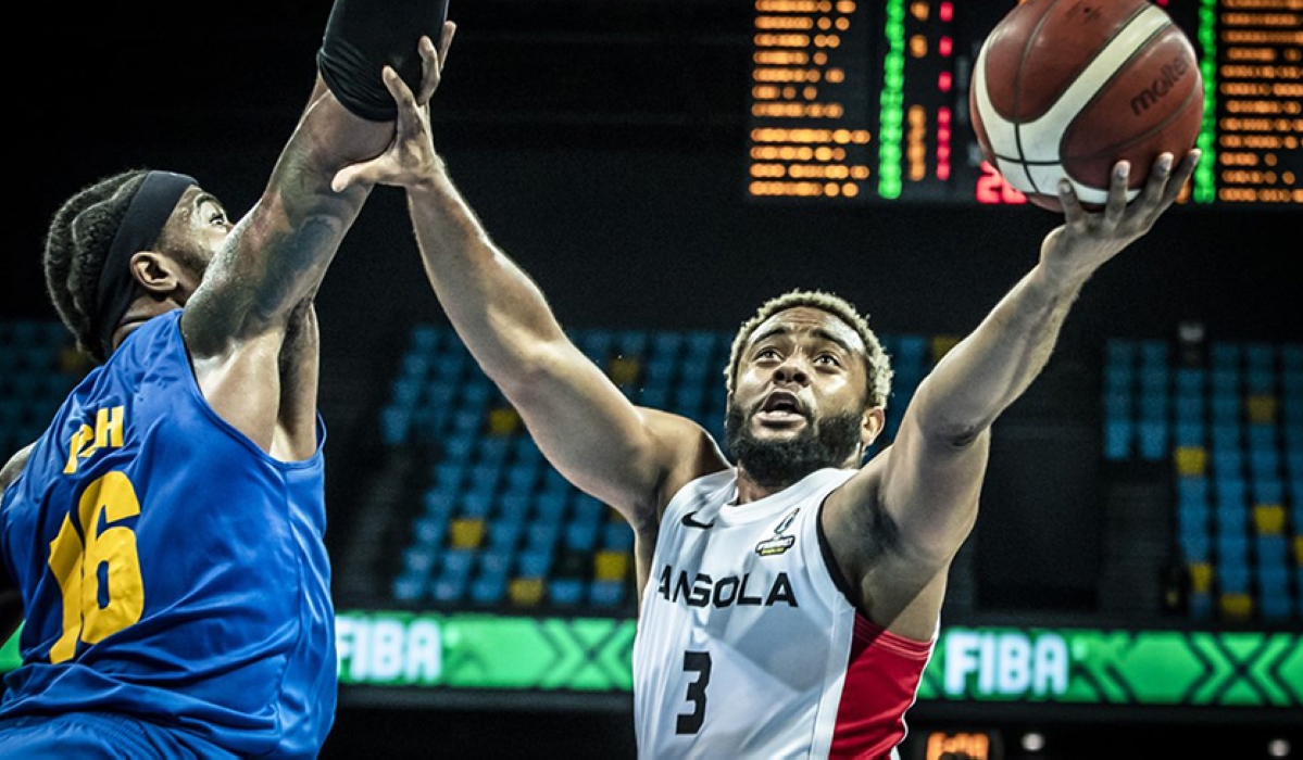 Angola’s Gerson Goncalves, with the ball, against Prince Ibeh of Rwanda, during a past game in Kigali. Photo: Courtesy.