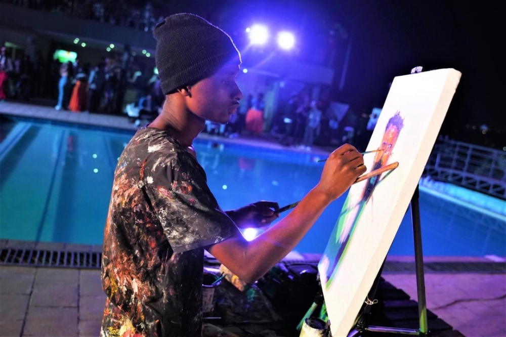 Henry Munyaneza doing live painting.