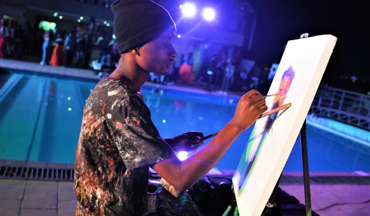 Henry Munyaneza doing live painting.