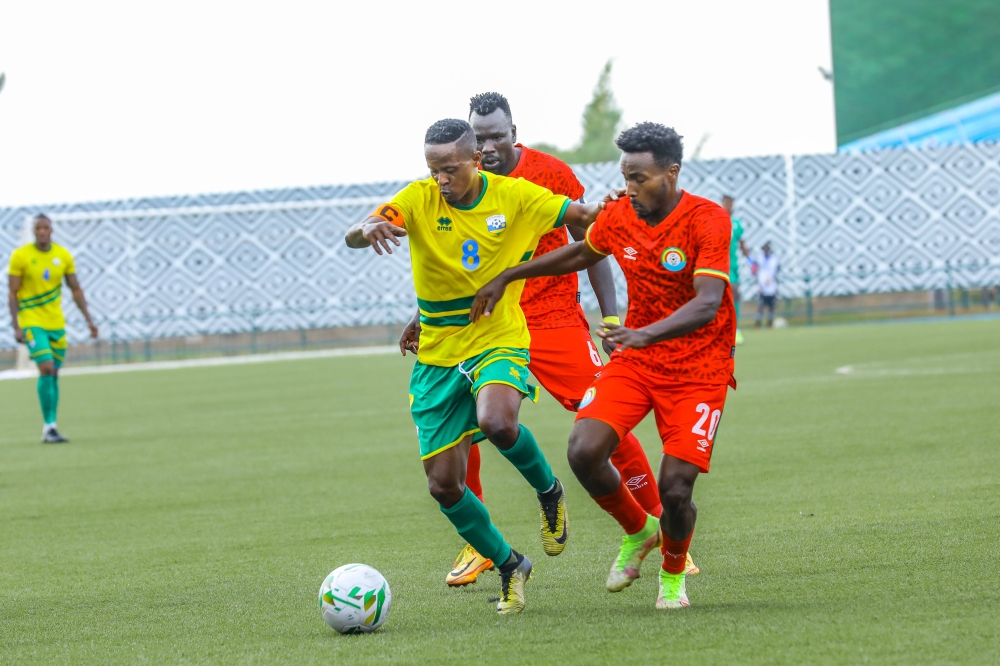 National Football team captain Haruna Niyonzima vies for the ball with Ethiopians during the second leg match at Huye Stadium on Saturday ,September 3. All Photos by Dan Nsengiyumva