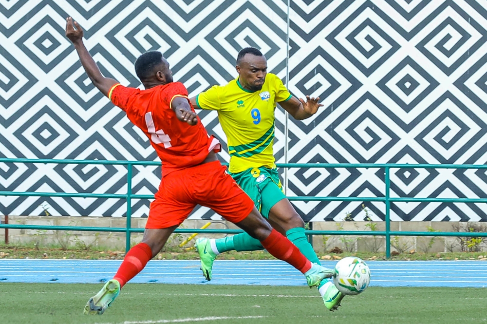 Striker Jacques Tuyisenge dribbles past Ethiopian defender during the game
