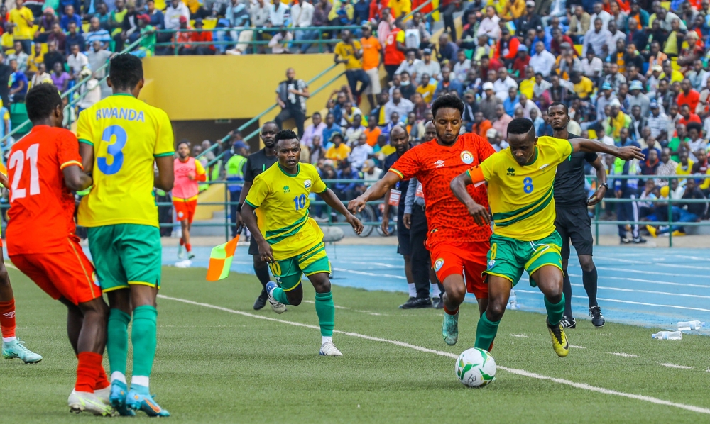 Amavubi captain Haruna Niyonzima dribbles past two Ethiopian defenders during the 2023 CHAN qualifier which Rwanda lost 1-0 and got eliminated.  The veteran midfielder was deployed on the wing despite not being as quick as he was in the past. / Photo: Dan Nsengiyumva