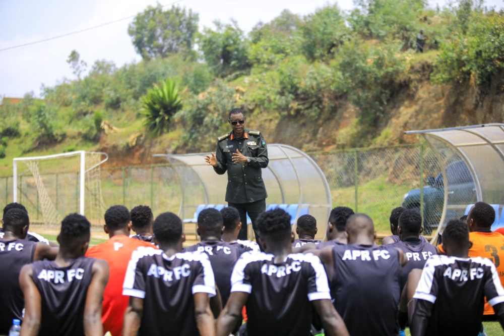 APR honorary chairman, Gen. James Kabarebe talks to the army side players after a training session. Kabarebe urged the team to eliminate their Tunisian opponents in the CAF champions’ league. Courtesy