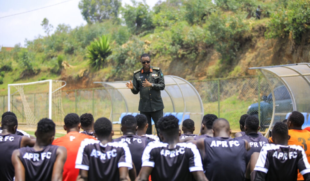 APR honorary chairman, Gen. James Kabarebe talks to the army side players after a training session. Kabarebe urged the team to eliminate their Tunisian opponents in the CAF champions’ league. Courtesy