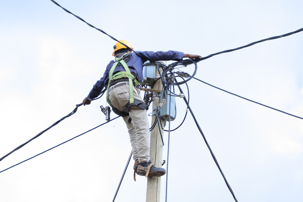 A technician during electricity supply exercise in Gicumbi. Rwanda needs over Rwf610 billion to ensure 100 percent access to electricity for the entire country’s population by 2024. File