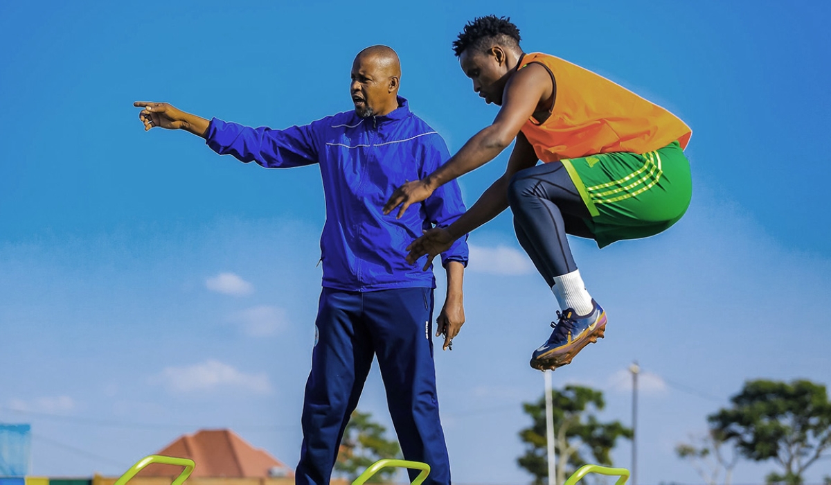 AS Kigali head coach Casa Mbungo Andre gives instructions to his players during a training session. / File