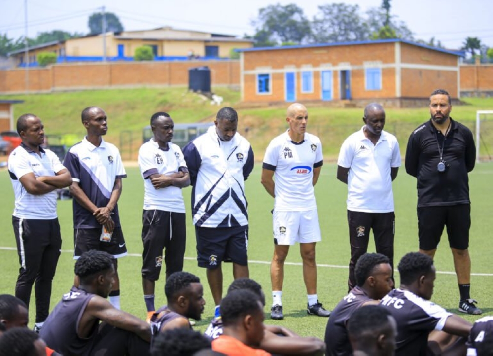 APR FC coach staff talk to players after a training session at Shyorongi Hotel in Rulindo District. Photo: Courtesy.