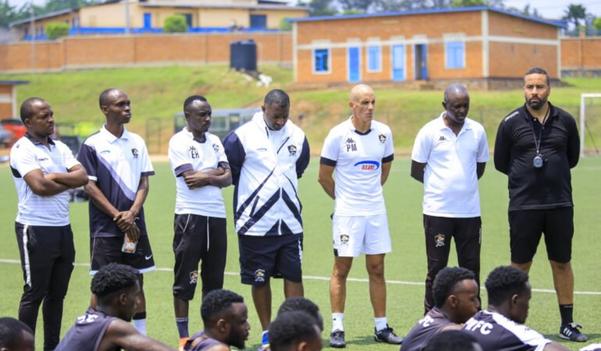 APR FC coach staff talk to players after a training session at Shyorongi Hotel in Rulindo District. Photo: Courtesy.