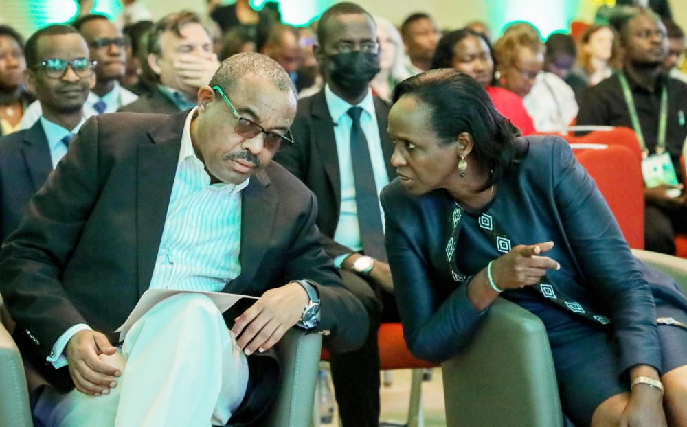 Hailemariam Desalegn, the Board Chairman of Alliance for a Green Revolution in Africa (left), consults with Agnes Kalibata, AGRA President, during a session of the ongoing 12th Africa Green Revolution Forum in Kigali. Photo: Dan Nsengiyumva.