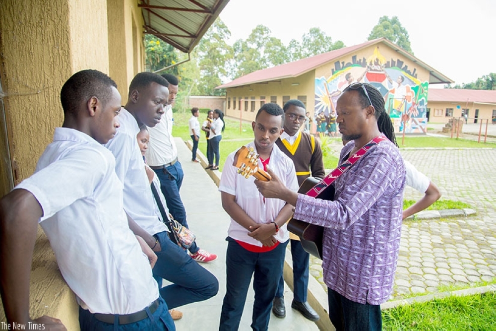 Jaques Muligande teaching some of the students at the school.  File photo.