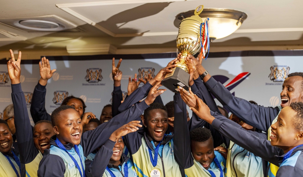 The national U-19 women cricket players hoist the trophy as they celebrate defeating Tanzania by 6 wickets on Monday, September 12 to qualify
for the 2023 women cricket World Cup that will be held in South Africa. Photo: Courtesy.