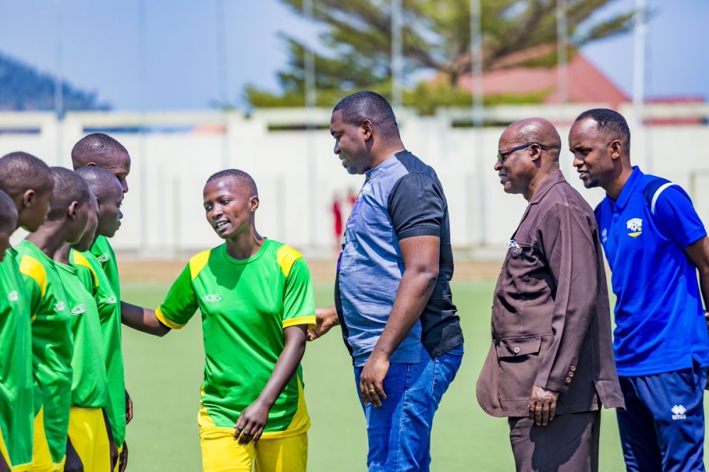 The President of the Fédération Rwandaise du Sport Scolaire (FRSS), Father Innocent Gatete with Permenant Secretary at Ministry of Sports Didier Shema Maboo as they visit students who will represent Rwanda. He urged them to observe discipline and be accountable during the competition.