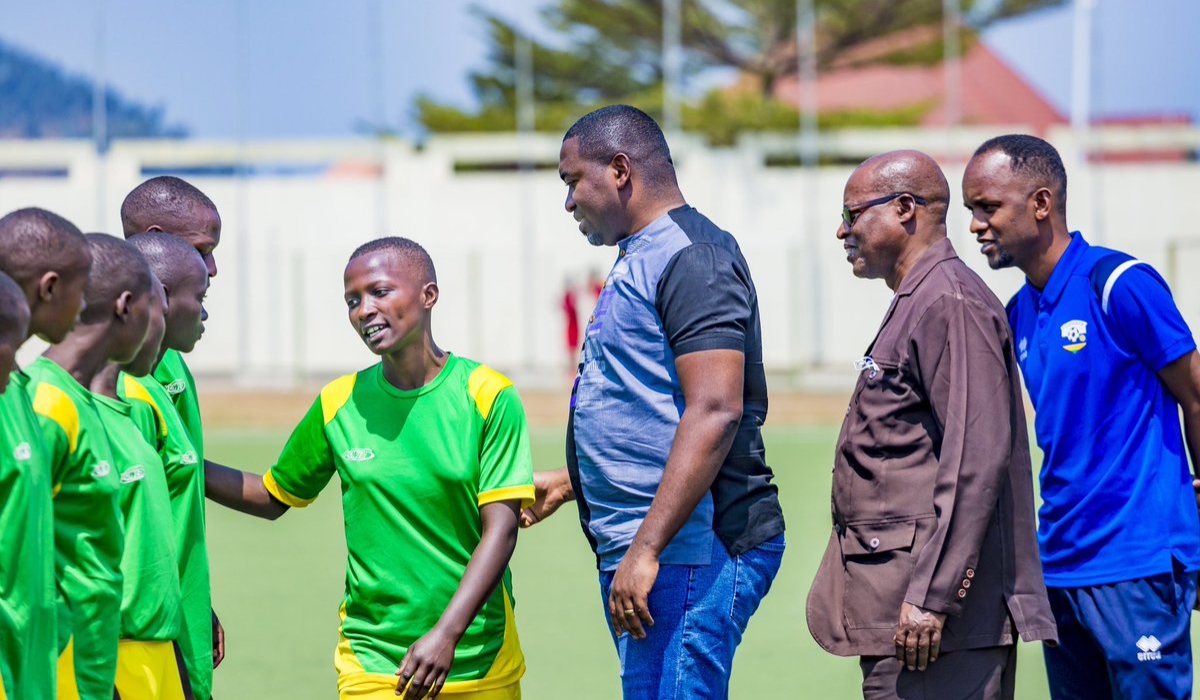 The President of the Fédération Rwandaise du Sport Scolaire (FRSS), Father Innocent Gatete with Permenant Secretary at Ministry of Sports Didier Shema Maboo as they visit students who will represent Rwanda. He urged them to observe discipline and be accountable during the competition.