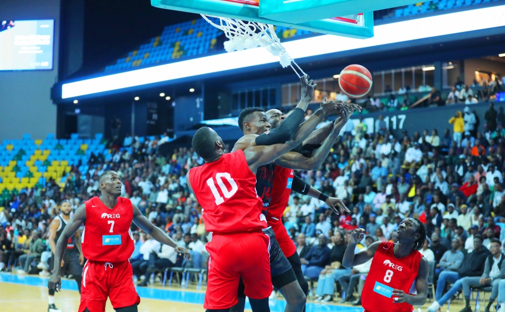 REG players vie for the ball with Patriots&#039;  during the game at BK Arena on Wednesday evening. Patriots Basketball Club beat Rwanda Energy Group (REG) 78-65 to tie the best-of-five finals at 2-2 after game four. All Photos by Dan Nsengiyumva