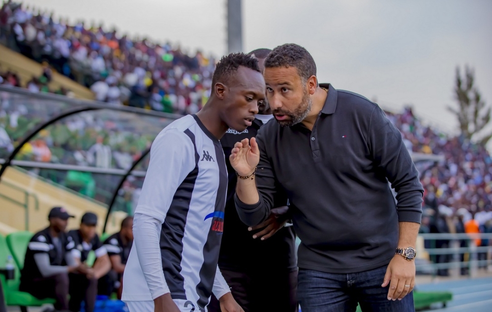 APR FC head coach gives instructions to midfielder Alain Kwitonda during the first leg match at Huye Stadium. APR won the tie 1-0 in Huye and only need to avoid defeat to progress to the next round. Photo: Christophe Renzaho.
