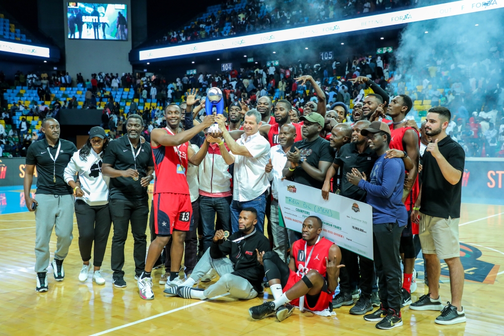 Ron Weiss, the Chief Executive Officer of Rwanda Energy Group, and players celebrate after beating Patriots to win the title on September 18. / All Photos by Dan Nsengiyumva