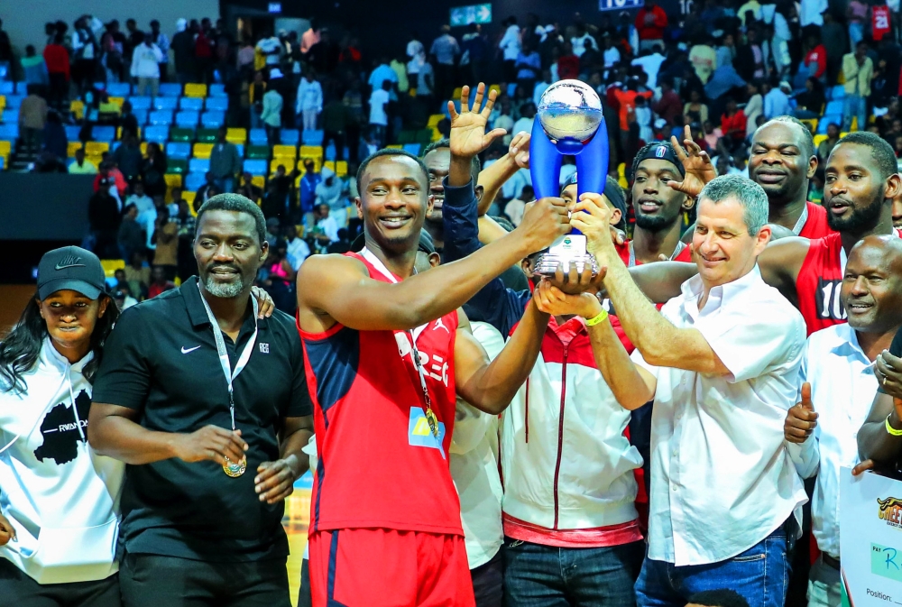 Ron Weiss, the Chief Executive Officer of Rwanda Energy Group and players celebrate after beating Patriots to win the title on September 18. All Photos by Dan Nsengiyumva