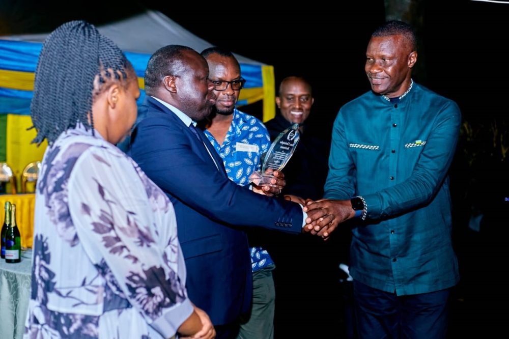 Maj Gen Charles Karamba, Rwanda’s High Commissioner to the United Republic of Tanzania and Seychelles (right), shakes hands with Christophe Bazivamo, during a farewell reception in honour of the Deputy Secretary General of the East African Community in charge of Productive and Social Sectors and his wife, in Arusha on September 17. / Photo: Courtesy
