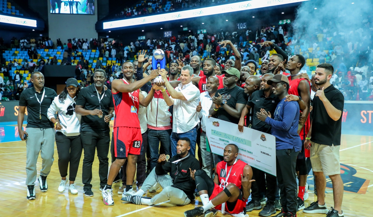 Ron Weiss, the Chief Executive Officer of Rwanda Energy Group, and players celebrate after beating Patriots to win the title on September 18. / All Photos by Dan Nsengiyumva