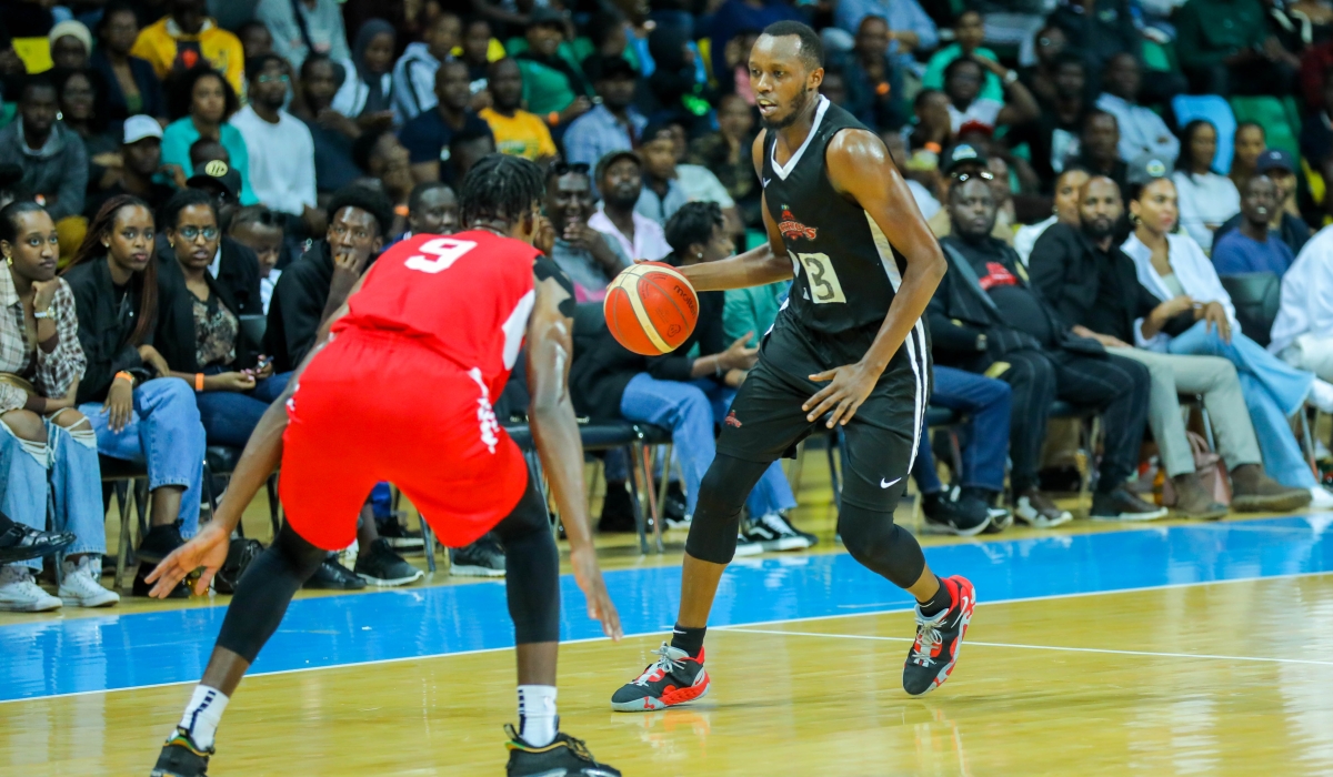 Patriots forward Steven Hagumintwari  tries to drible past REG’s US-based power-forward Axel Mpoyo during a past league game. Photo: Dan Nsengiyumva.