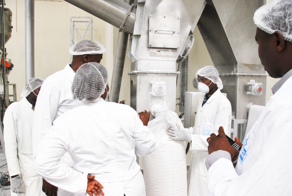Officials during a tour of Kinazi Cassava Processing Plant in Ruhango District. The Government is set to invest about Rwf2 billion to revamp the struggling factory. Photo: File.