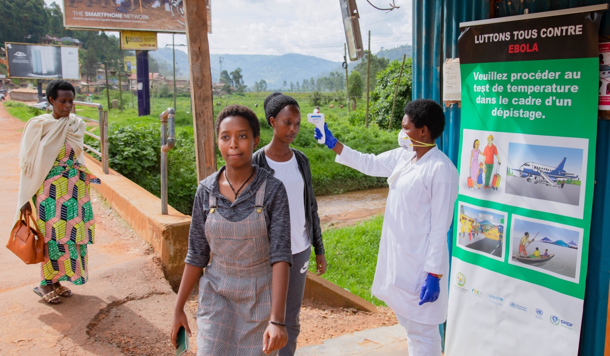 A health worker during temperature screening at Gatuna One-Stop Border Post on May 27, 2019. Rwanda has taken fresh measures to prevent Ebola virus from spilling over into the country from Uganda. / File