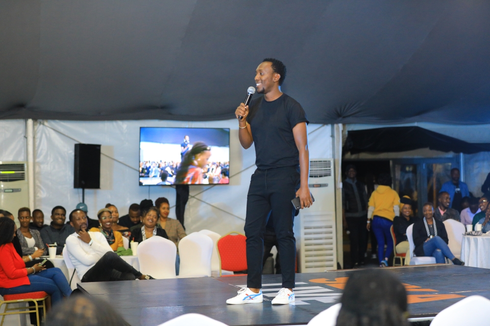 Local comedian who was the host of the show, Arthur Nkusi during the performance.