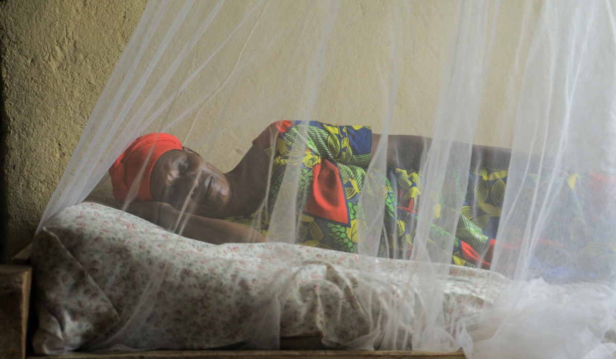 A sleeping  woman under a mosquitoes net in Bugesera District .In 2020, an estimated 241 million people had malaria, and 627,000 of them died, an increase of 69,000 deaths over the previous year in the world. .Dan Nsengiyumva
