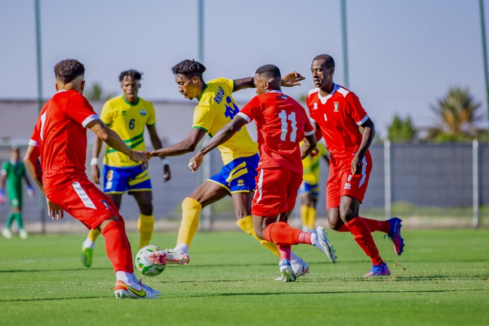 Amavubi striker Evode Mugunga tries to get past Equatorial
Guinea defenders during last week’s friendly tie. Rwanda will play DR Congolese side Saint Eloi Lupopo in
another friendly on Tuesday in Morocco. Courtesy