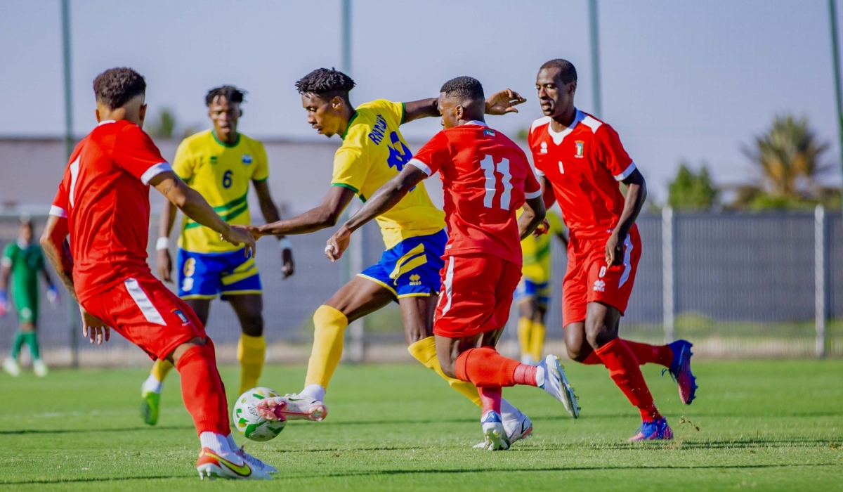 Amavubi striker Evode Mugunga tries to get past Equatorial
Guinea defenders during last week’s friendly tie. Rwanda will play DR Congolese side Saint Eloi Lupopo in
another friendly on Tuesday in Morocco. Courtesy