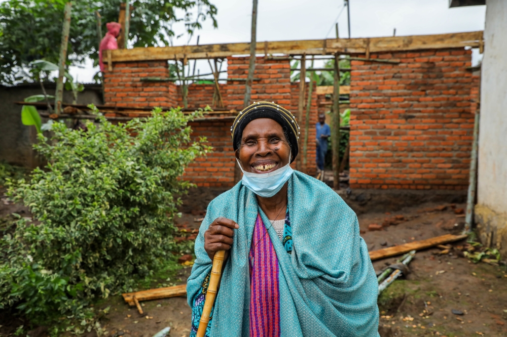 80-year-old Théopiste Nyirabikali talks to the writer in Kinigi. She is one of more than 80 residents
who have started benefiting from development activities aimed at supporting communities living
around the park. All photos: Dan Nsengiyumva.