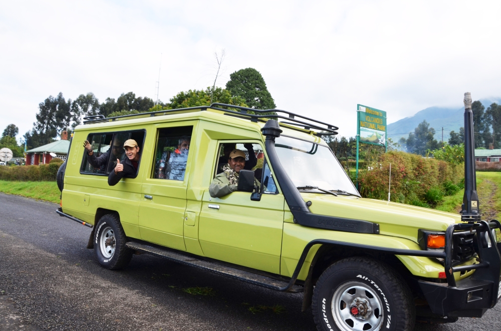 Tourists cheer on Kinigi residents after visiting mountain gorillas in Volcanoes National Park. Over 80 per cent of businesses in the tourism sector have recovered following the ease of the Covid-19 pandemic. / Sam Ngendahimana