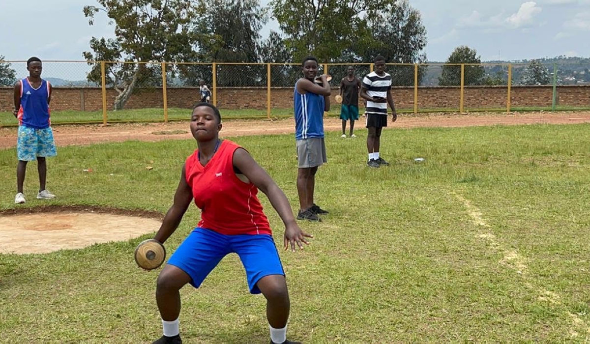 A young female athlete prepares to throw a disc during the just-concluded training camp in Gicumbi. The Rwanda Athletics Federation (RAF) president Lt. Col (Rtd) Lemuel Kayumba believes their new talent search could help them produce new athletes with potential to win medals on the global stage.Courtesy 
