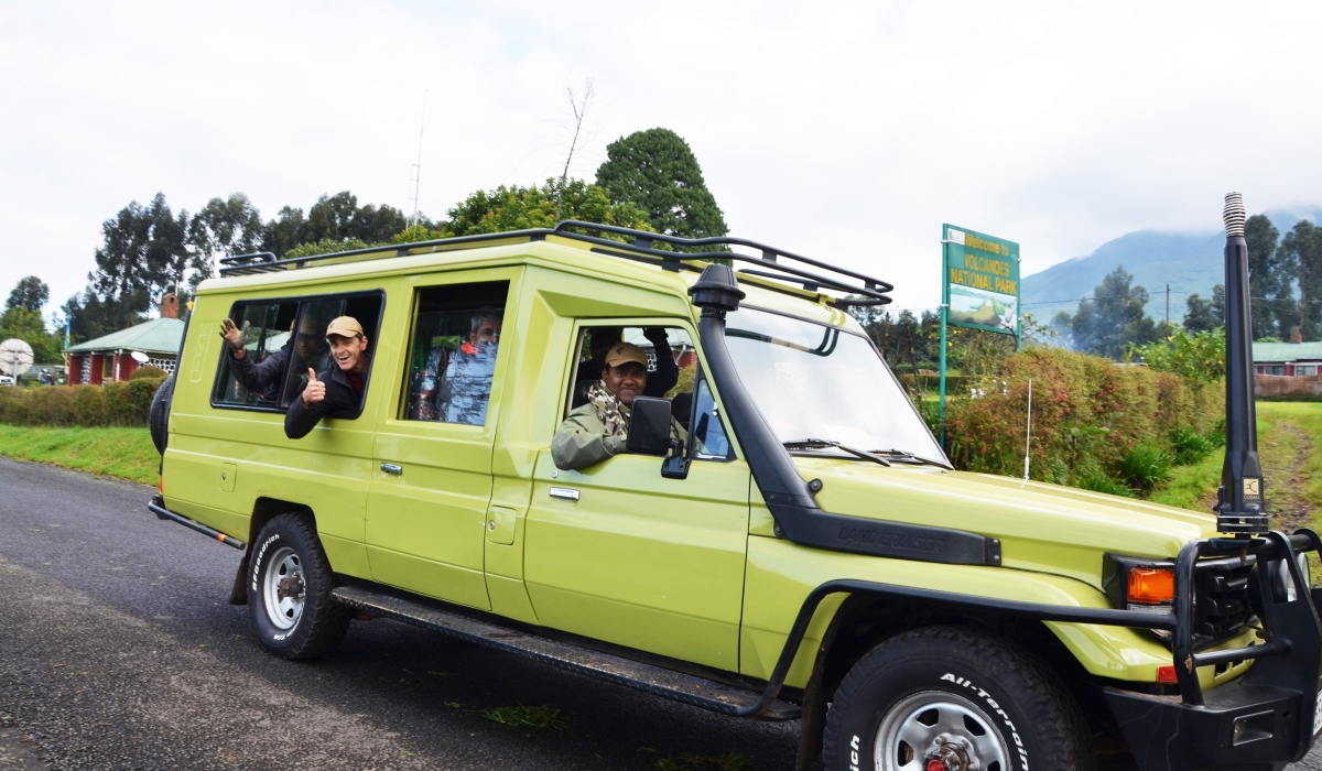 Tourists cheer on Kinigi residents after visiting mountain gorillas in Volcanoes National Park. Over 80 per cent of businesses in the tourism sector have recovered following the ease of the Covid-19 pandemic. / Sam Ngendahimana