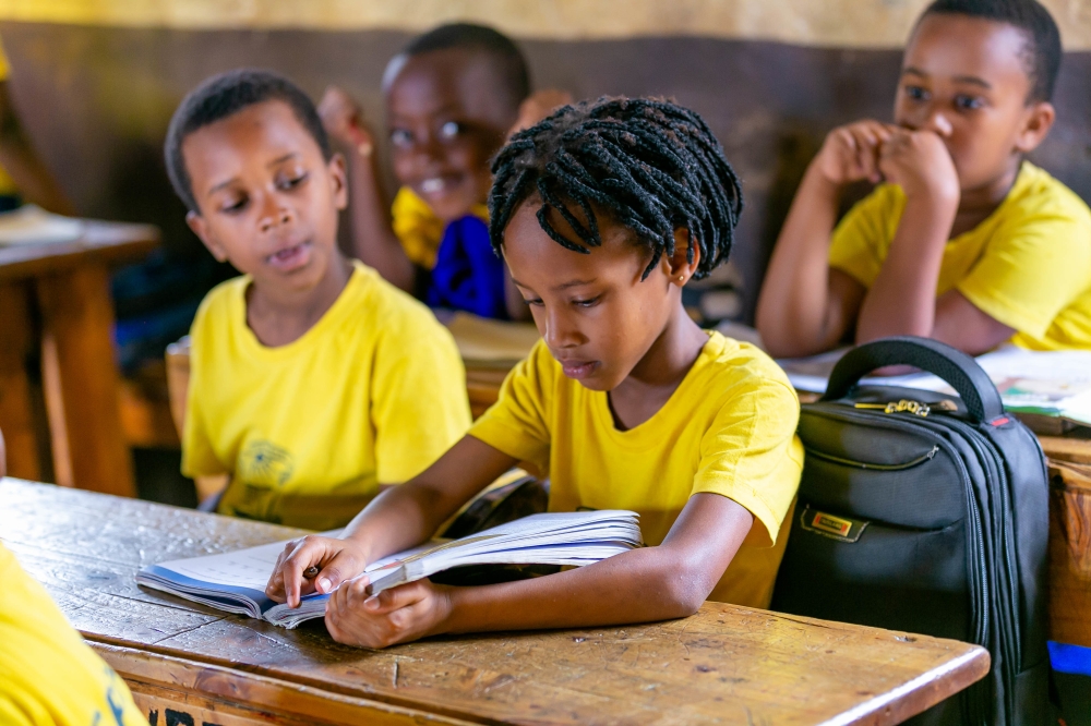A pupil during a reading exercise at Groupe Scolaire Camp Kigali. According to the Ministry of Education there is a need for collective efforts to address the shortage of reading materials in schools.File