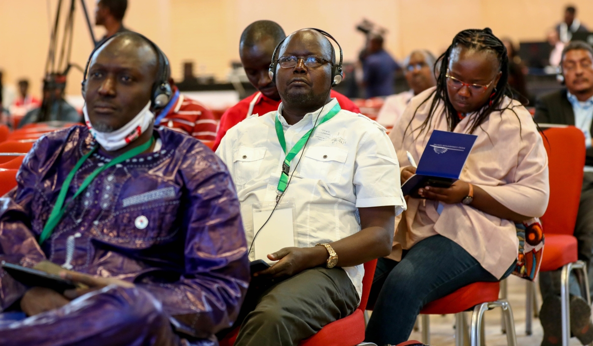 Delegates follow a panel discussion on Climate Change on  the Biodiversity Nexus through interpreting at the  APAC 2022 in Kigali.  Dan Nsengiyumva