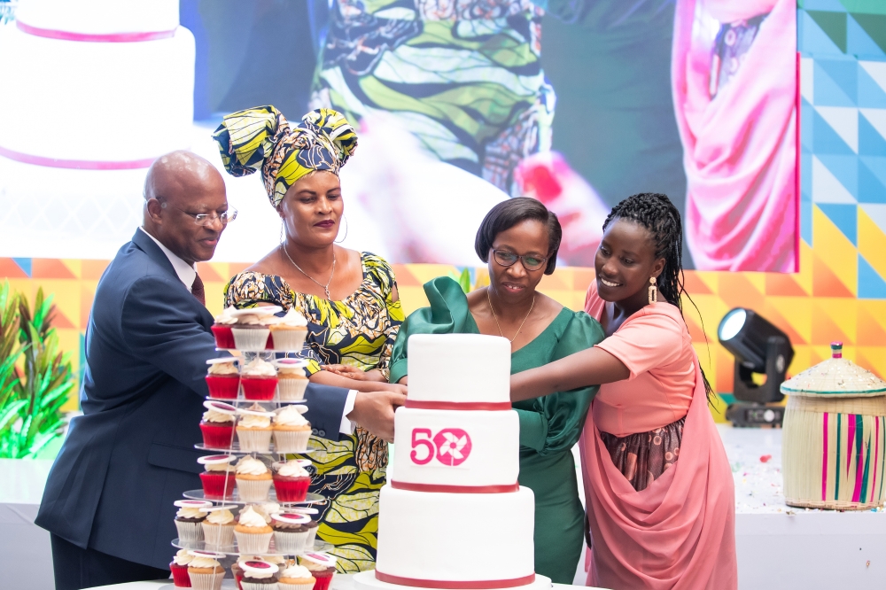 Officials cut a cake to celebrate  50 year anniversary themed “50 Years of Igniting Hope From Bangladesh to the World,” at Kigali Convention Centre. Courtesy