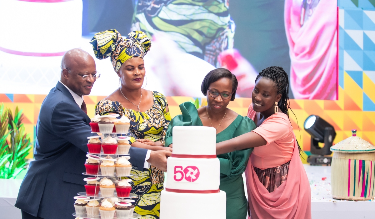 Officials cut a cake to celebrate  50 year anniversary themed “50 Years of Igniting Hope From Bangladesh to the World,” at Kigali Convention Centre. Courtesy